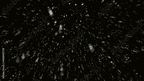 Snow falling on isolated black background
