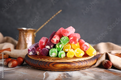 Board with tasty Turkish delight on table