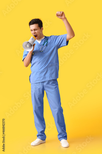 Protesting male doctor with...