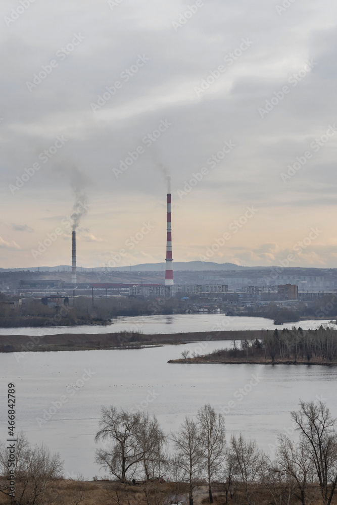 Industrial landscape of the right bank of Krasnoyarsk, high chimneys over the city