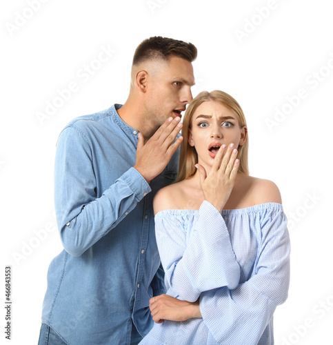 Gossiping young couple on w...