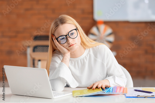 Tired young female teacher ...