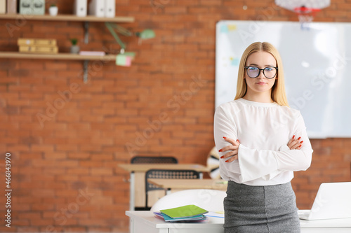 Young female teacher with e...