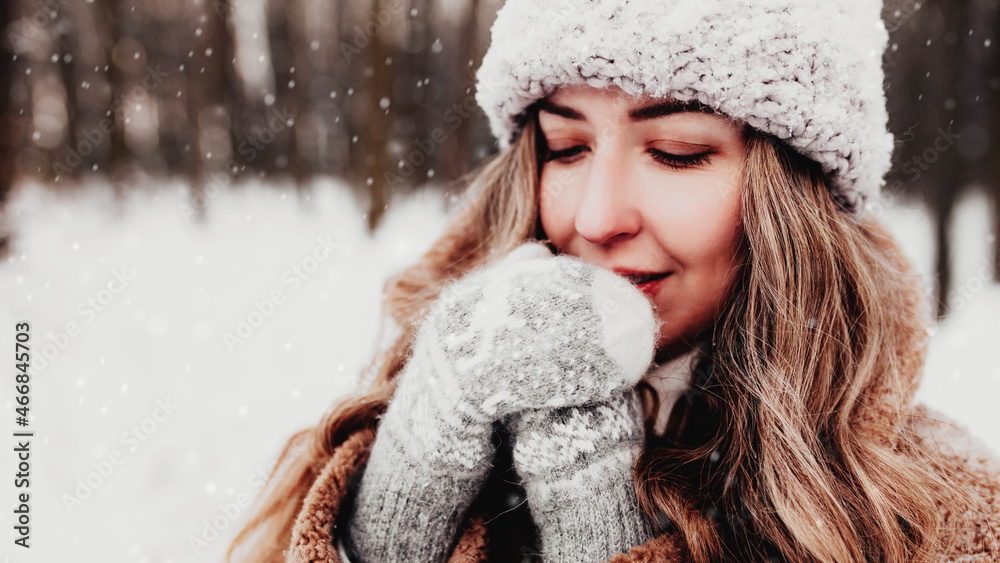 Beautiful young woman in snowy fancy winter woodland. Christmas forest, trees Beautiful young woman in snowy fancy winter woodland. Christmas forest, trees