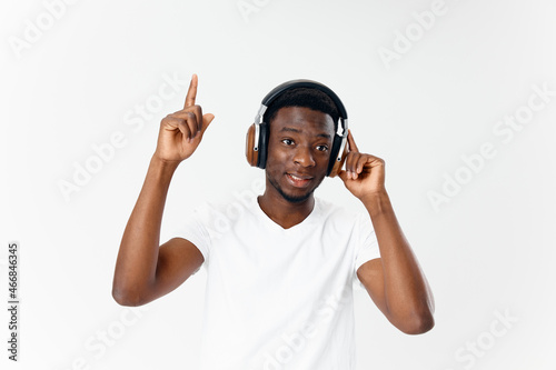 African American in headphones music emotion fun isolated background