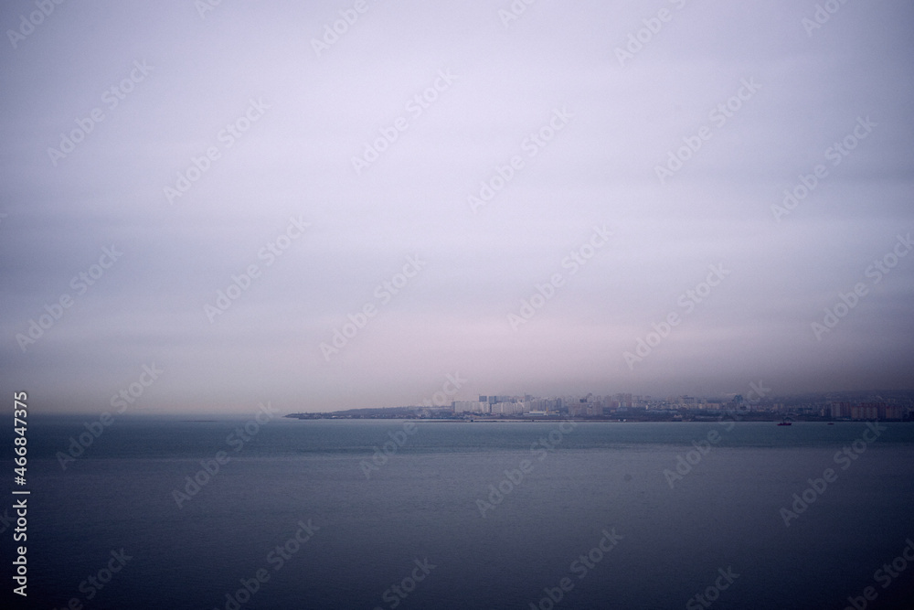 The image of the sea bay in the fog weather.