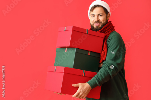 Handsome man in Santa hat w...