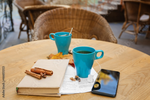 Blue cup of hot tea with bo...