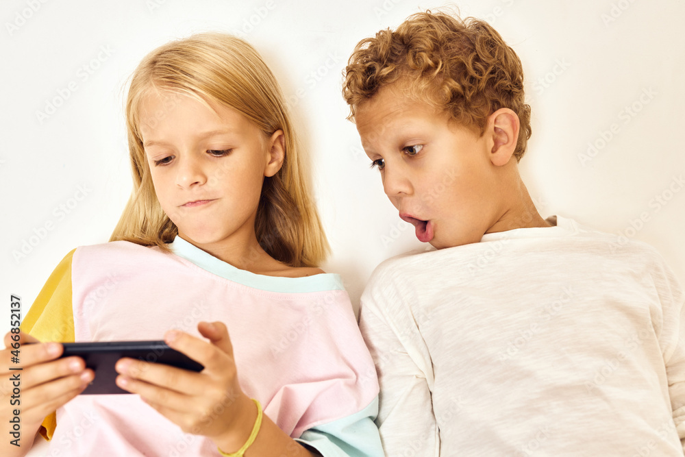 boy looks at the phone he is next to the girl emotions boy looks at the phone he is next to the girl emotions