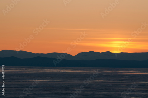 sunset over frozen lake Baikal 