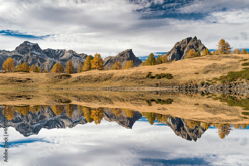 Alps mountains at mirror, autumn landscape
