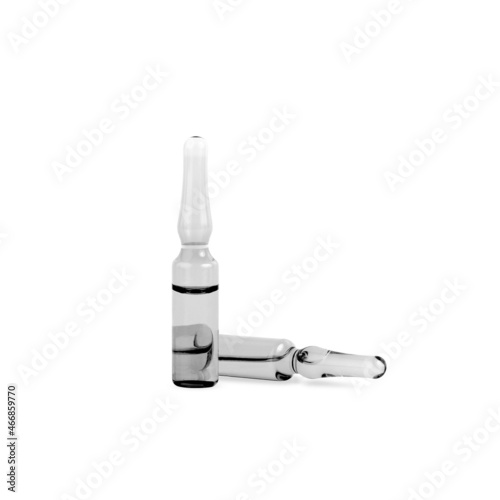 Ampoules. 2 glass black and white ampoules isolated on a white background. Universal ampoules for storing various liquid substances for medical purposes and for the beauty industry.