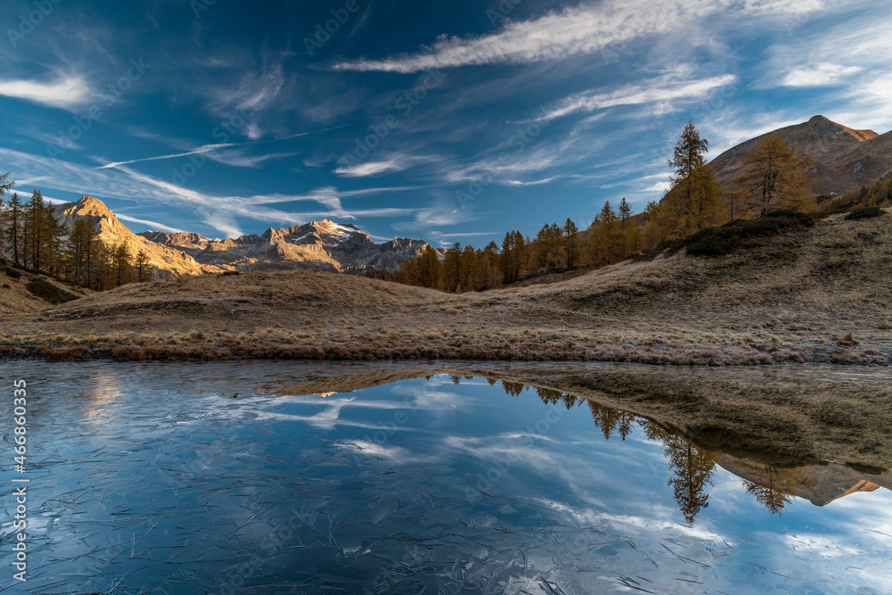 The frozen lake in the wild Alps, fine art landscape