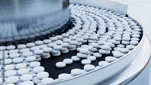 White tablets on the conveyor.