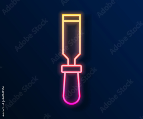 Glowing neon line Chisel tool for wood icon isolated on black background. Vector