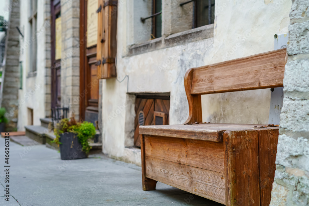 Very old wooden bench in a medieval facade. Tallinn Estonia. Very old wooden bench in a medieval facade. Tallinn Estonia.