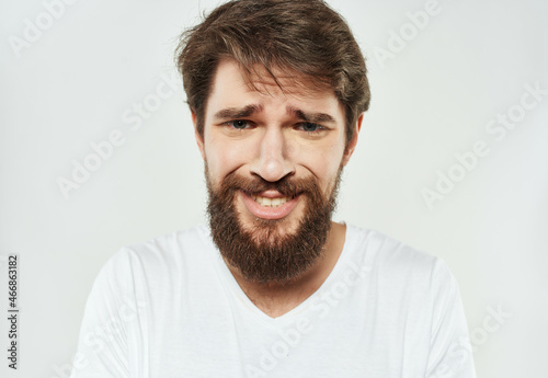 emotional man in a white t-shirt expressive look discontent Lifestyle