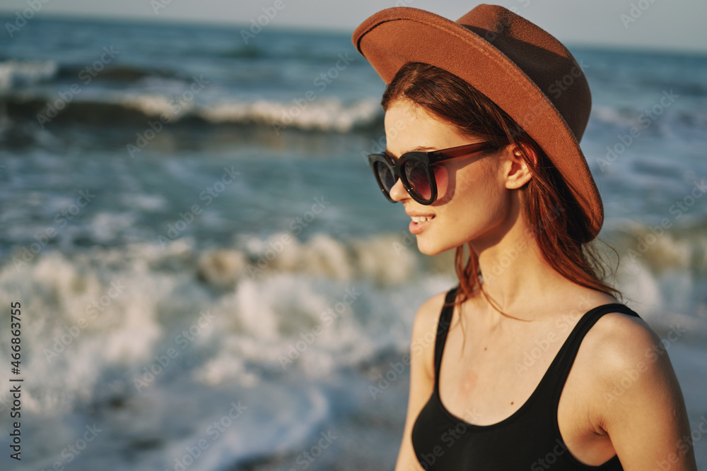woman walking on the beach hat travel vacation sun woman walking on the beach hat travel vacation sun
