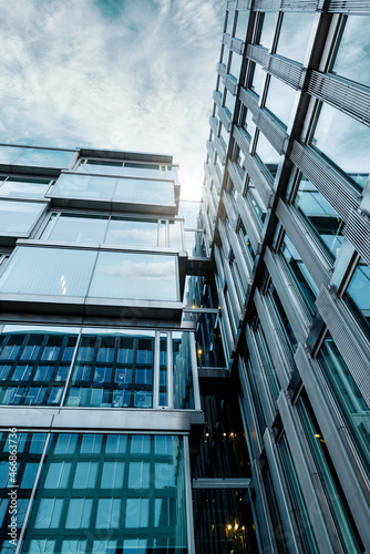 Looking Up Blue Modern Office Building. Background of Modern Glass Building Skyscrapers