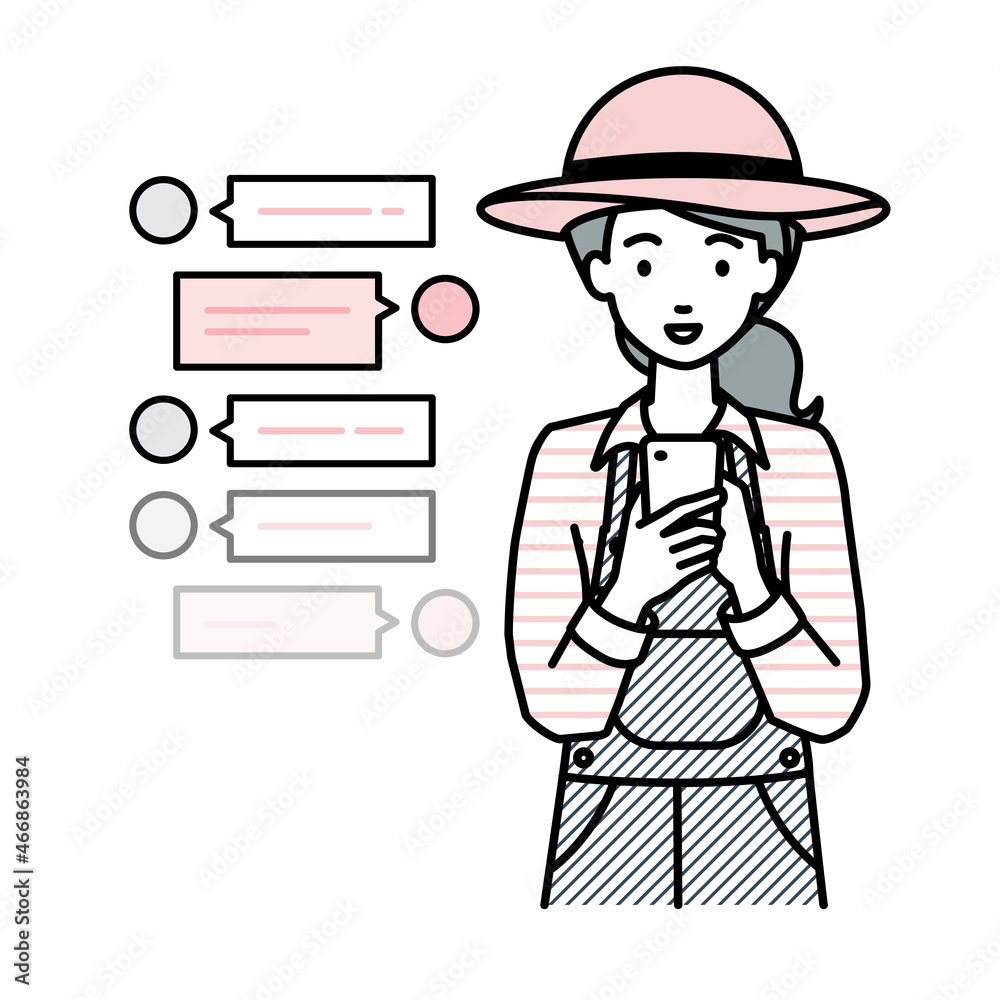立ってスマートフォンで楽しくチャットで会話する農家の女性