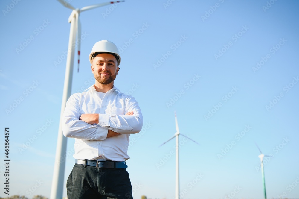 Businessmen engineering standing handsome smile front of turbine looking away Businessmen engineering standing handsome smile front of turbine looking away