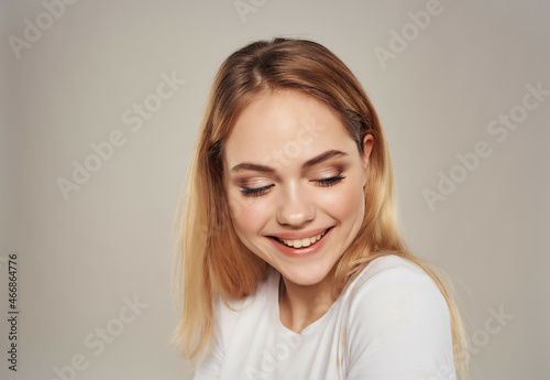 cheerful woman in a white attractive look happy Lifestyle light background