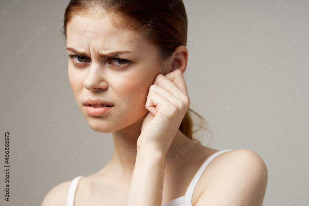 sick woman poor hearing disorders in white t-shirts studio treatment sick woman poor hearing disorders in white t-shirts studio treatment
