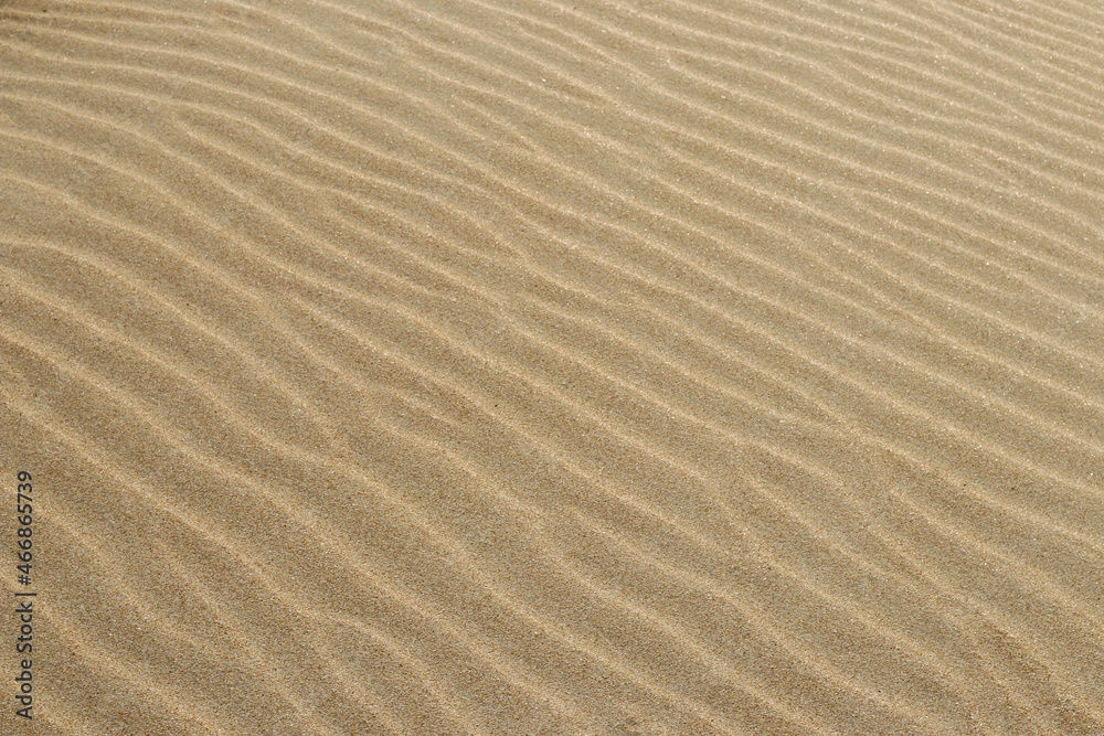 Sand texture. Sandy beach for background. Top view. Natural sand stone texture background. sand on the beach as background. Wavy sand background for summer designs. Sand texture. Sandy beach for background. Top view. Natural sand stone texture background. sand on the beach as background. Wavy sand background for summer designs.