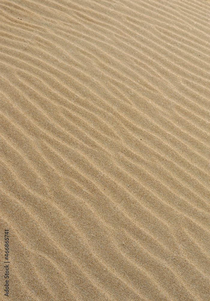 Sand texture. Sandy beach for background. Top view. Natural sand stone texture background. sand on the beach as background. Wavy sand background for summer designs. Sand texture. Sandy beach for background. Top view. Natural sand stone texture background. sand on the beach as background. Wavy sand background for summer designs.