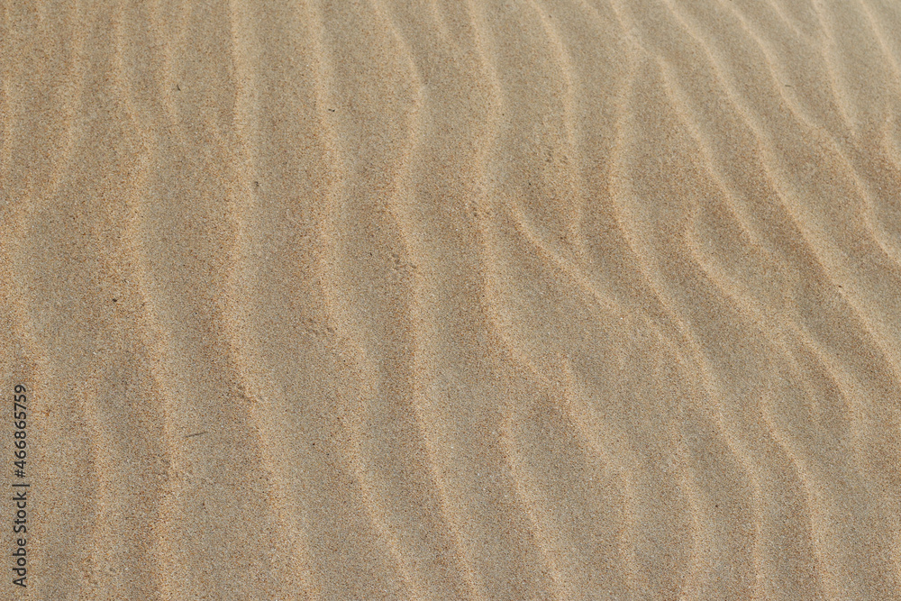 Sand texture. Sandy beach for background. Top view. Natural sand stone texture background. sand on the beach as background. Wavy sand background for summer designs. Sand texture. Sandy beach for background. Top view. Natural sand stone texture background. sand on the beach as background. Wavy sand background for summer designs.