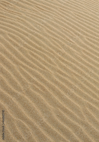 Sand texture. Sandy beach for background. Top view. Natural sand stone texture background. sand on the beach as background. Wavy sand background for summer designs.