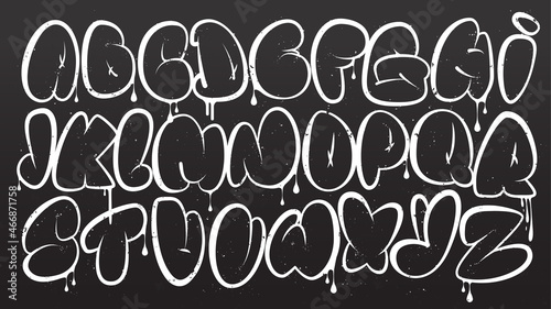 Graffiti alphabet. Bubble graffiti letters outline. White uppercase letters with texture effect, drips, and spray effect on dark background. Graffiti font.