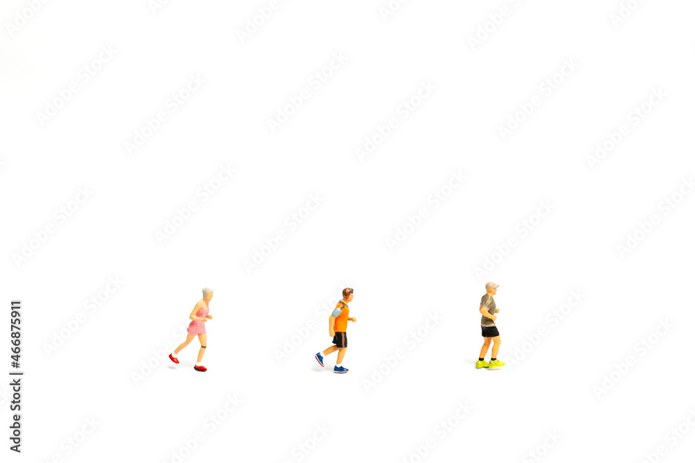 Miniature people running on white background , Healthy lifestyle and sport concepts.