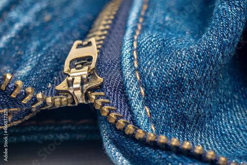 Close up of blue jeans with zipper.