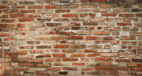 Old rustical wall made of bricks and mortar photo