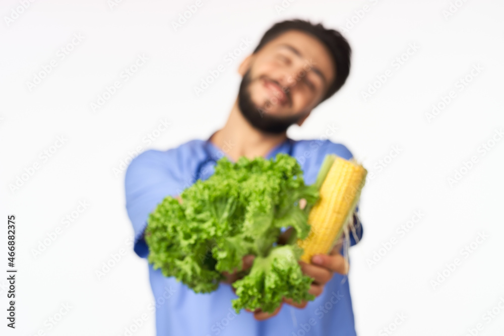 male nutritionist with vegetables in the hands of health calories male nutritionist with vegetables in the hands of health calories