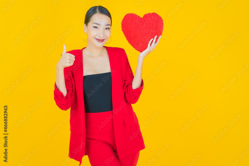 Portrait beautiful young asian woman smile with heart pillow shape Portrait beautiful young asian woman smile with heart pillow shape