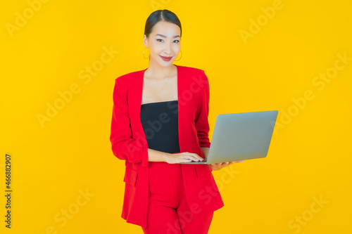 Portrait beautiful young asian woman smile with computer laptop