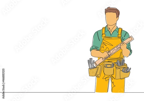 Single continuous line drawing of young handyman wearing building construction uniform while holding spirit level. Craftsman home repair service concept. One line draw design illustration
