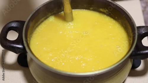 Pumpkin soup preparation. Using blender