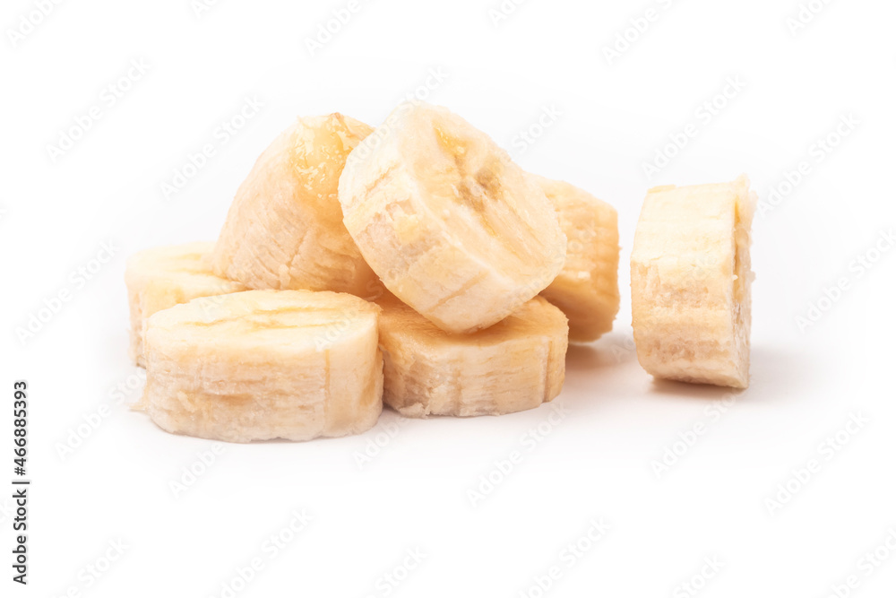 on a white background. peeled banana, cut into pieces. close-up. on a white background. peeled banana, cut into pieces. close-up.