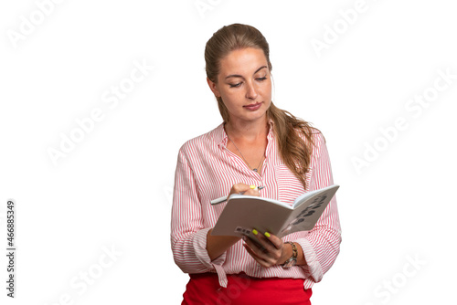 Young girl teacher with a notebook in her hands. Tells students a lecture and will take their exam. White background. Place for text