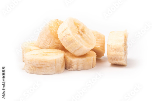 on a white background. peeled banana, cut into pieces. close-up.
