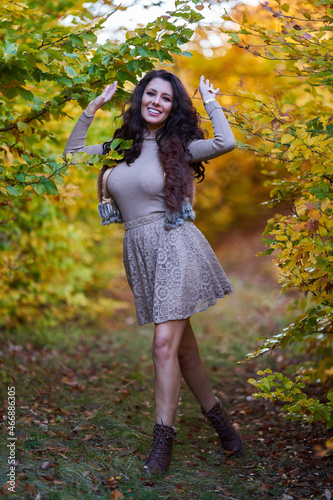 Attractive young woman in autumnal landscape