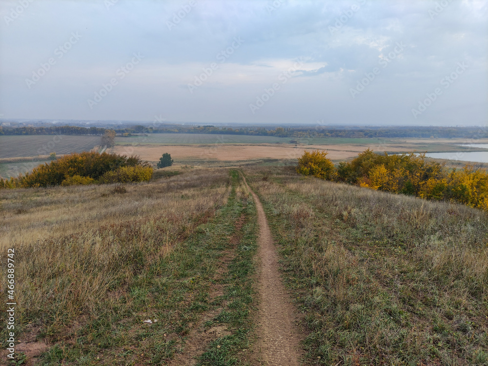Narrow path through the hills in autumn Narrow path through the hills in autumn