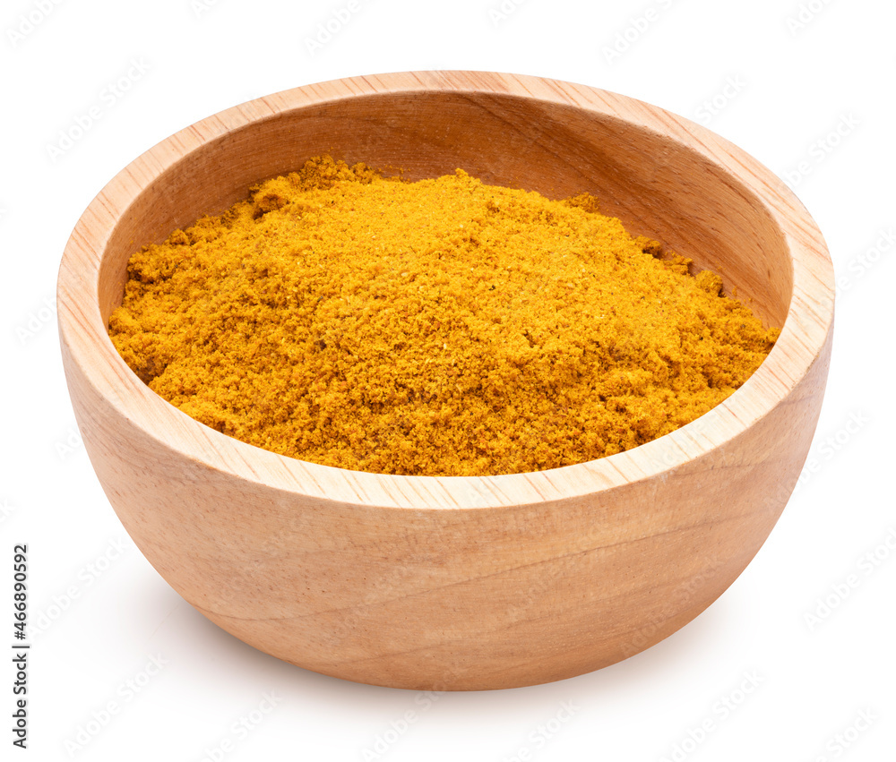 Curry Powder isolated on white background, Turmeric Powder on a wooden blow on white background With clipping path. Curry Powder isolated on white background, Turmeric Powder on a wooden blow on white background With clipping path.