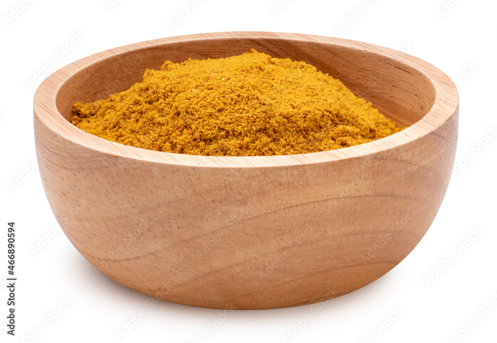 Curry Powder isolated on white background, Turmeric Powder on a wooden blow on white background With clipping path. Curry Powder isolated on white background, Turmeric Powder on a wooden blow on white background With clipping path.