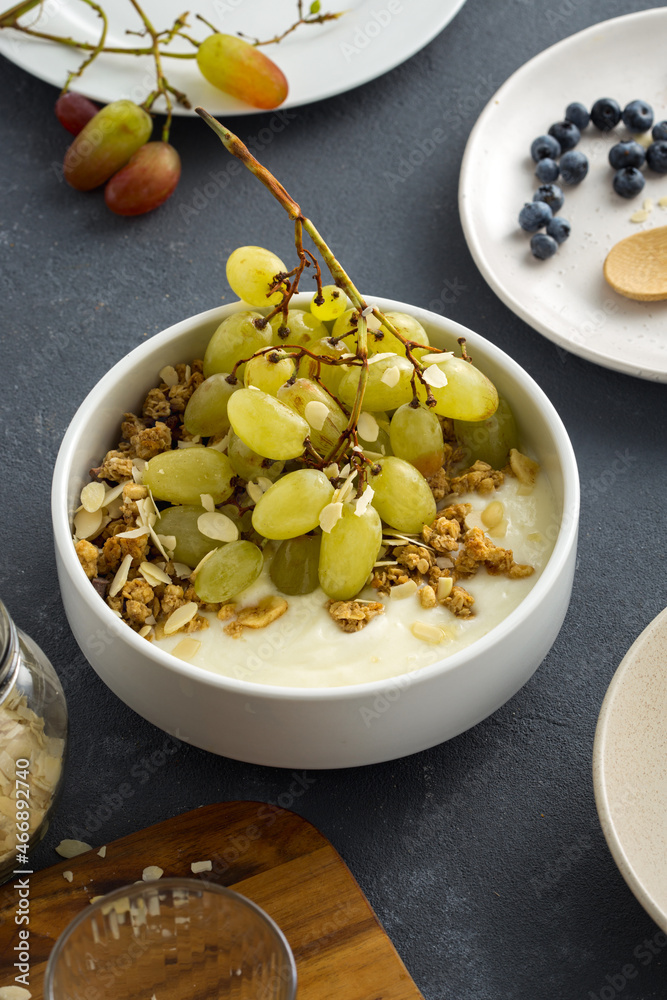 Granola breakfast with grapes and almond flakes Granola breakfast with grapes and almond flakes