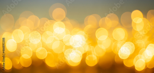 gold abstract background with bokeh defocused lights