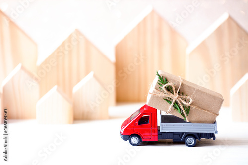 gift box on red toy car. Christmas holiday celebration concept. empty copy space for inscription. Holiday background.